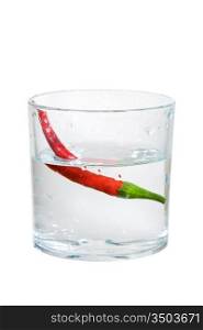 pepper falling into water isolated on a white background