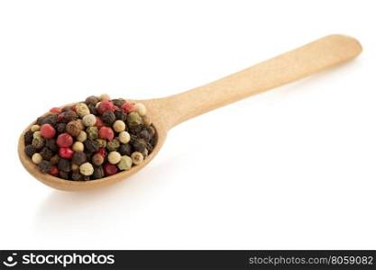 pepper in spoon isolated on white background