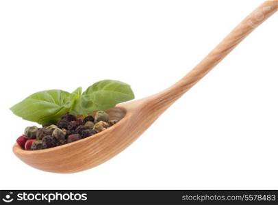 Pepper seasoning mix in wooden spoon isolated on white background cutout