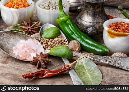 peppercorn and Indian spice. Variety of spices and seasonings on kitchen table