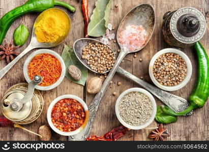 peppercorn and Indian spice. Variety of spices and seasonings on kitchen table