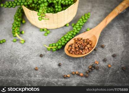 peppercorns on basket and dark background / fresh green peppercorn and black pepper seed for ingredients cuisine thai food herbs and spices