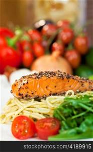 Peppered Salmon Fillet with Spaghetti Pasta Tomatoes and Green Salad