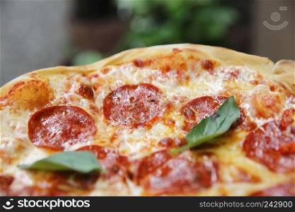 pepperoni pizza on wood background