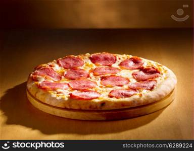 pepperoni pizza on wooden background