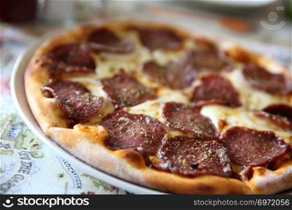 Pepperoni pizza , pizza with pepperoni mozzarella cheese and tomatoes with sauce background italian food