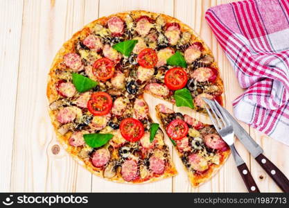 Pepperoni Pizza with Sausage, Cheese, Mozzarella, Olives and Basil Studio Photo. Pepperoni Pizza with Sausage, Cheese, Mozzarella, Olives and Bas