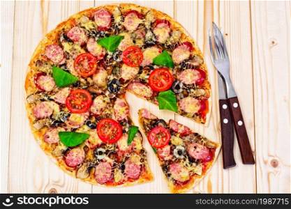Pepperoni Pizza with Sausage, Cheese, Mozzarella, Olives and Basil Studio Photo. Pepperoni Pizza with Sausage, Cheese, Mozzarella, Olives and Bas