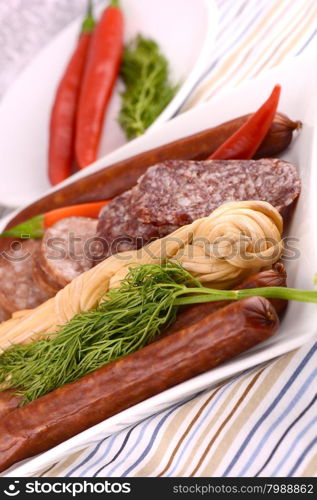 Pepperoni Salami and cheese on a cutting board