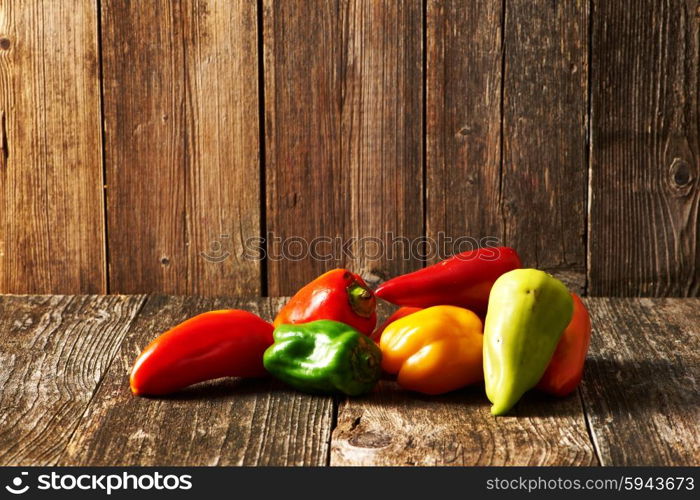 Peppers on old wooden table