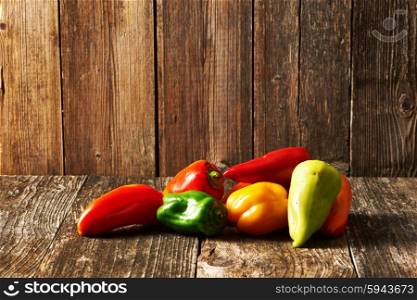 Peppers on old wooden table