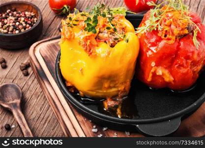 Peppers stuffed with rice and meat in iron pan. Pepper stuffed with meat