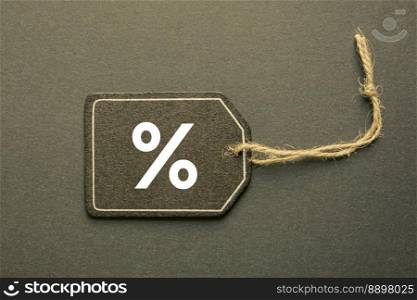 percent sign on the black price tag, black mockup background