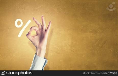 Percent sign. Percentage symbol and hand showing ok gesture