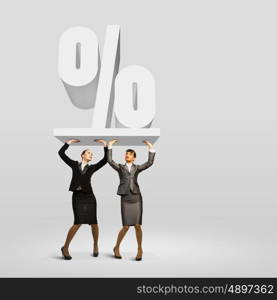 Percentage. Image of two businesswomen holding percentage symbol above head