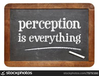 Perception is everything - white chalk text on a vintage slate blackboard
