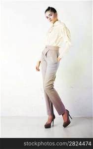 Perfect fashionable lady wearing white trousers and blouse