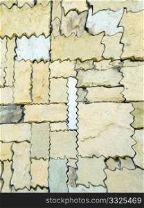 Perfect Fit Stone wall with puzzle shaped natural stones in light brown and beige