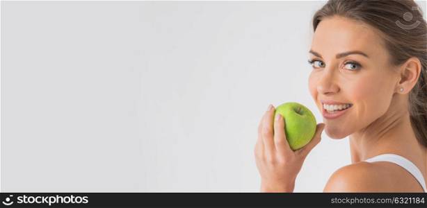 Perfect woman with apple. Beautiful young woman with green apple close up on white background
