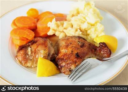 Perfectly grilled lemon and herb marinaded chicken served with mashed potatoes and boiled carrots