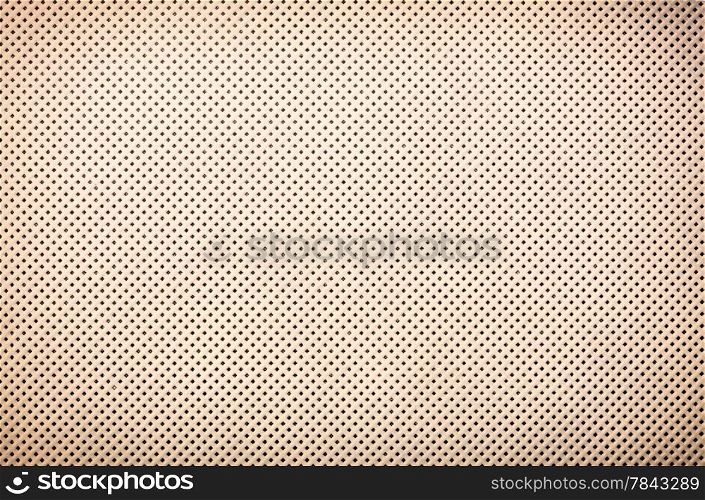 perforated beige textile pattern texture background or backdrop
