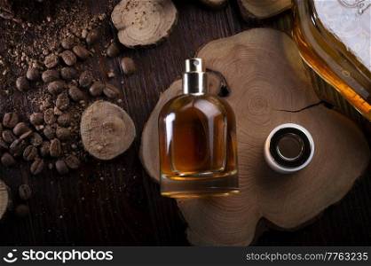  perfume bottles around ingredients  on juniper wooden. flat lay. perfumery concept