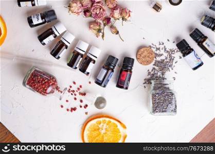 perfume ingridients around white background. Perfumer, beauty and trendy concept. flat lay