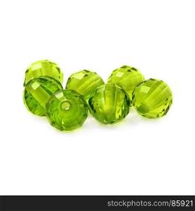 Peridot color beads on a white background.