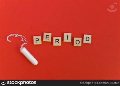 period word with scrabble letters tampon