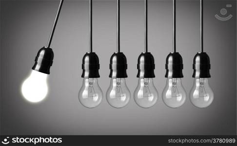 Perpetual motion with light bulbs. Idea concept on gray background