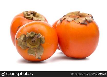 Persimmon fruits on white background.