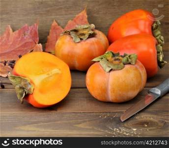 Persimmon Fruits On Wooden Background ,Close Up