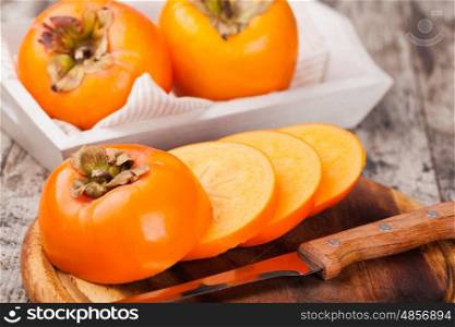 persimmon. persimmons on wooden background