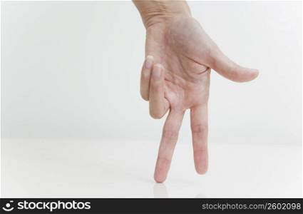 Person&acute;s hand imitating to walk