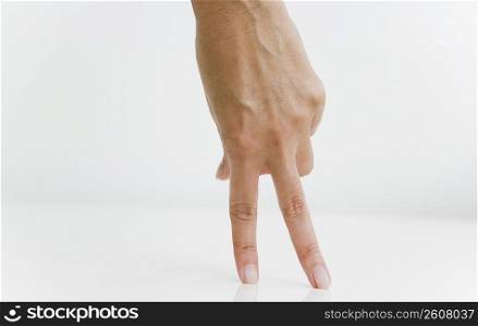 Person&acute;s hand imitating to walk