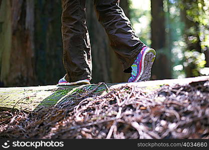 Person balance walking in forest