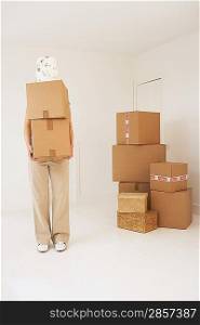 Person carrying moving boxes