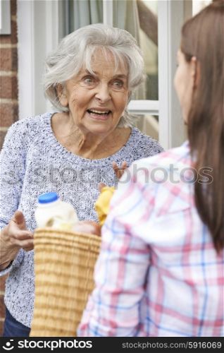 Person Doing Shopping For Elderly Neighbour