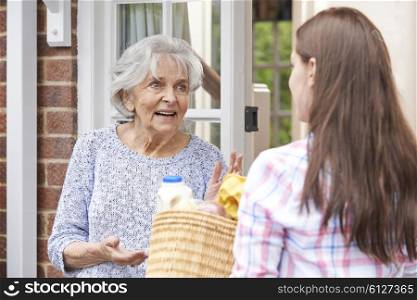 Person Doing Shopping For Elderly Neighbour