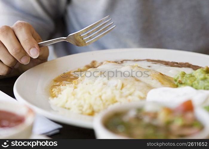 Person eating Mexican food