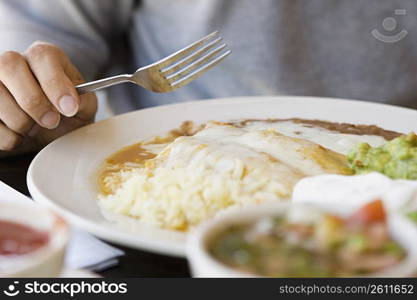 Person eating Mexican food