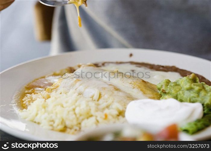 Person eating Mexican food