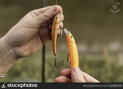 person fixing fish hook