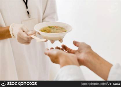 person getting bowl soup