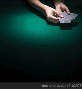 person hand s holding poker card