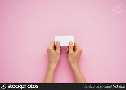 person hands holding little paper. High resolution photo. person hands holding little paper. High quality photo