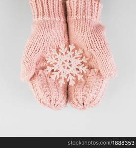 person hands in mittens with paper snowflake . Resolution and high quality beautiful photo. person hands in mittens with paper snowflake . High quality and resolution beautiful photo concept
