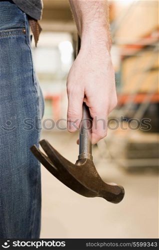 Person holding a hammer