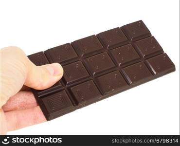 Person holding a whole bar of dark chocolate isolated towards white background