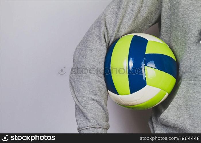 person holding ball with his arm. High resolution photo. person holding ball with his arm. High quality photo